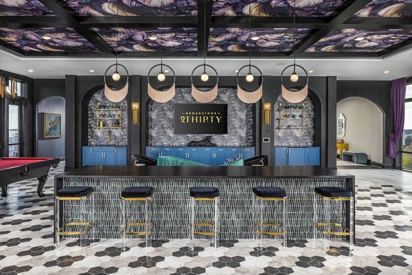 Clubhouse lobby with modern decor and seating at Broadstone 2Thirty Apartments