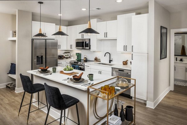 Modern kitchen with stainless steel appliances and granite countertops at Broadstone 2Thirty Apartments