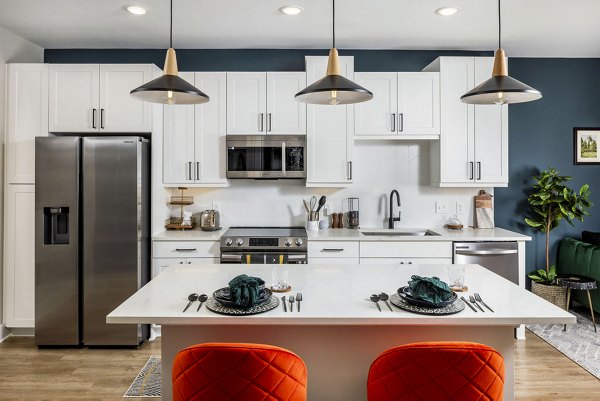 Modern kitchen with stainless steel appliances at Broadstone 2Thirty Apartments