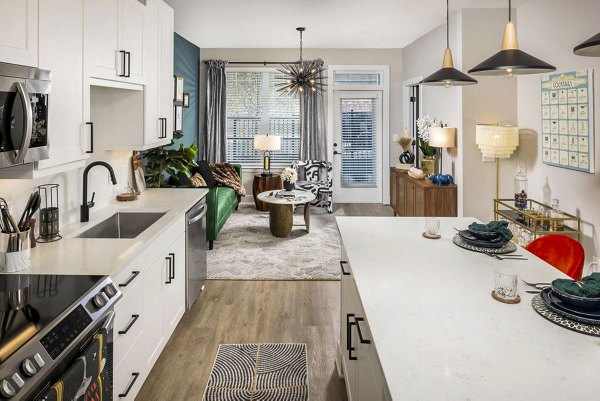 Modern kitchen with stainless steel appliances in Broadstone 2Thirty Apartments