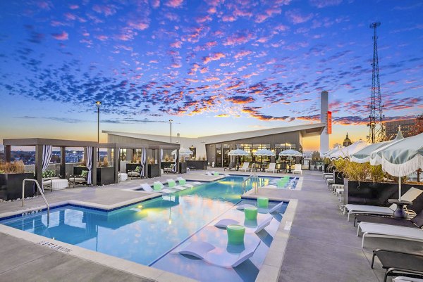 Resort-style pool with lounge chairs at Broadstone 2Thirty Apartments