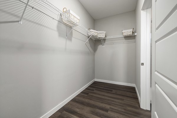 Stylish bedroom with modern decor at Everly on 401 Apartments