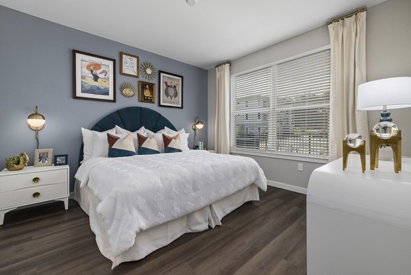 Contemporary bedroom design with elegant decor at Everly on 401 Apartments, showcasing luxury living spaces