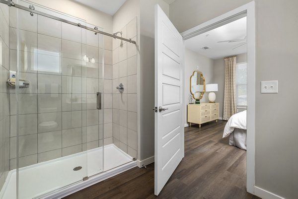 Modern bathroom with stylish fixtures at Everly on 401 Apartments