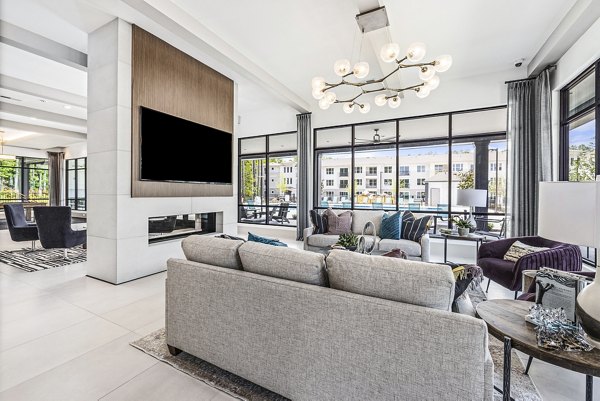 Modern clubhouse and welcoming lobby at Everly on 401 Apartments featuring luxurious seating and contemporary decor for residents