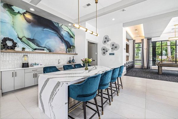 Clubhouse kitchen with granite countertops and modern appliances at Everly on 401 Apartments, offering luxury living spaces and amenities