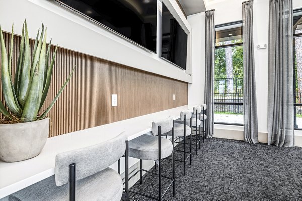 Elegant clubhouse with modern interiors at Everly on 401 Apartments, featuring luxury amenities for residents to enjoy