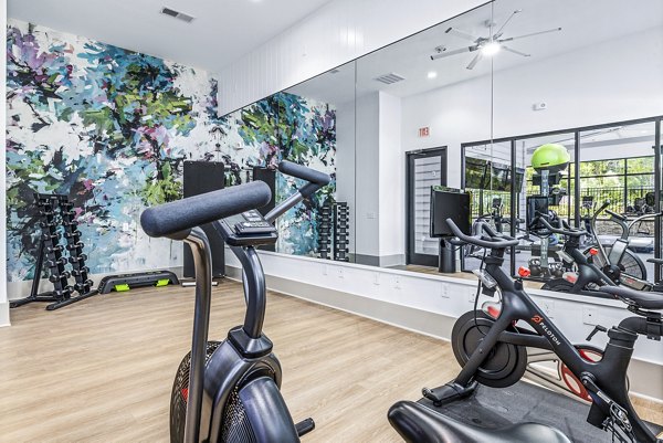 Yoga and spin studio with modern equipment at Everly on 401 Apartments