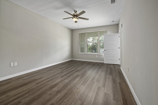 Everly on 401 living room featuring elegant furnishings and natural light at Greystar luxury apartments