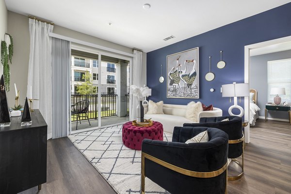 Spacious living room with modern furnishings at Everly on 401 Apartments