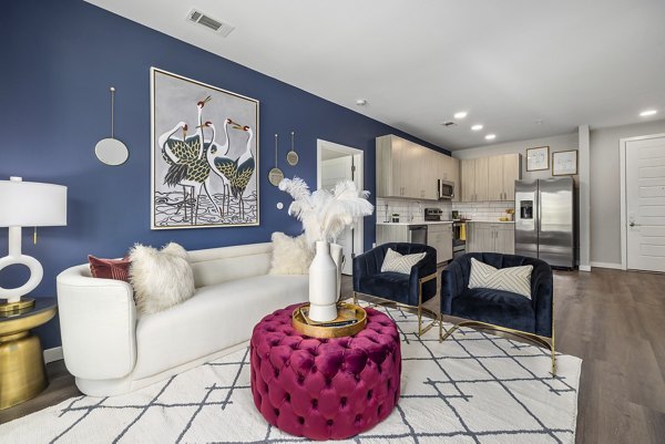 Spacious living room with modern decor at Everly on 401 Apartments
