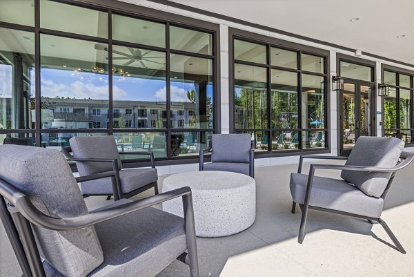 Patio space with modern outdoor seating at Everly on 401 Apartments, perfect for relaxation and social gatherings