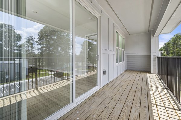 Spacious patio with stylish seating at Everly on 401 Apartments, ideal for luxury outdoor relaxation