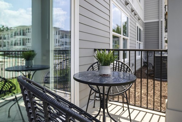 Modern outdoor patio featuring stylish seating at Everly on 401 Apartments