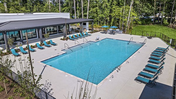 Indoor pool with natural light and modern design at Everly on 401 Apartments