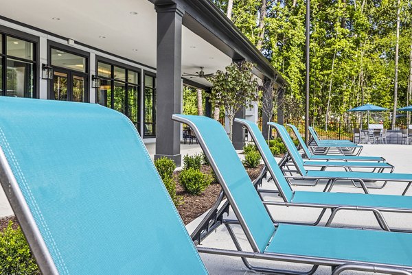 Resort-style pool and patio at Everly on 401 Apartments offering luxury relaxation