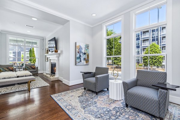 Clubhouse at Level at 401 Apartments: Modern communal space featuring comfortable seating and vibrant decor