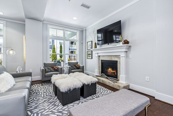 Clubhouse featuring modern seating areas and entertainment spaces at Level at 401 Apartments