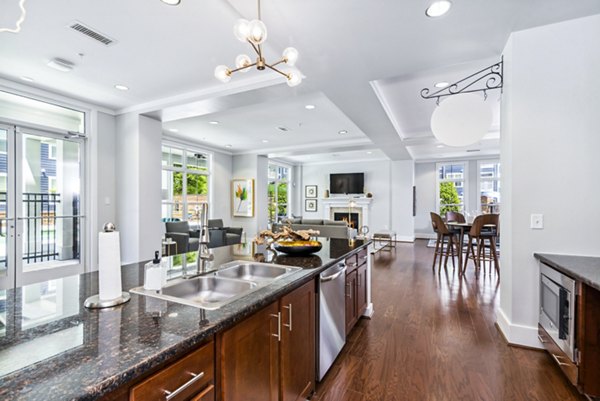 Stylish clubhouse featuring modern decor at Level at 401 Apartments, perfect for social gatherings and relaxation in a luxury setting