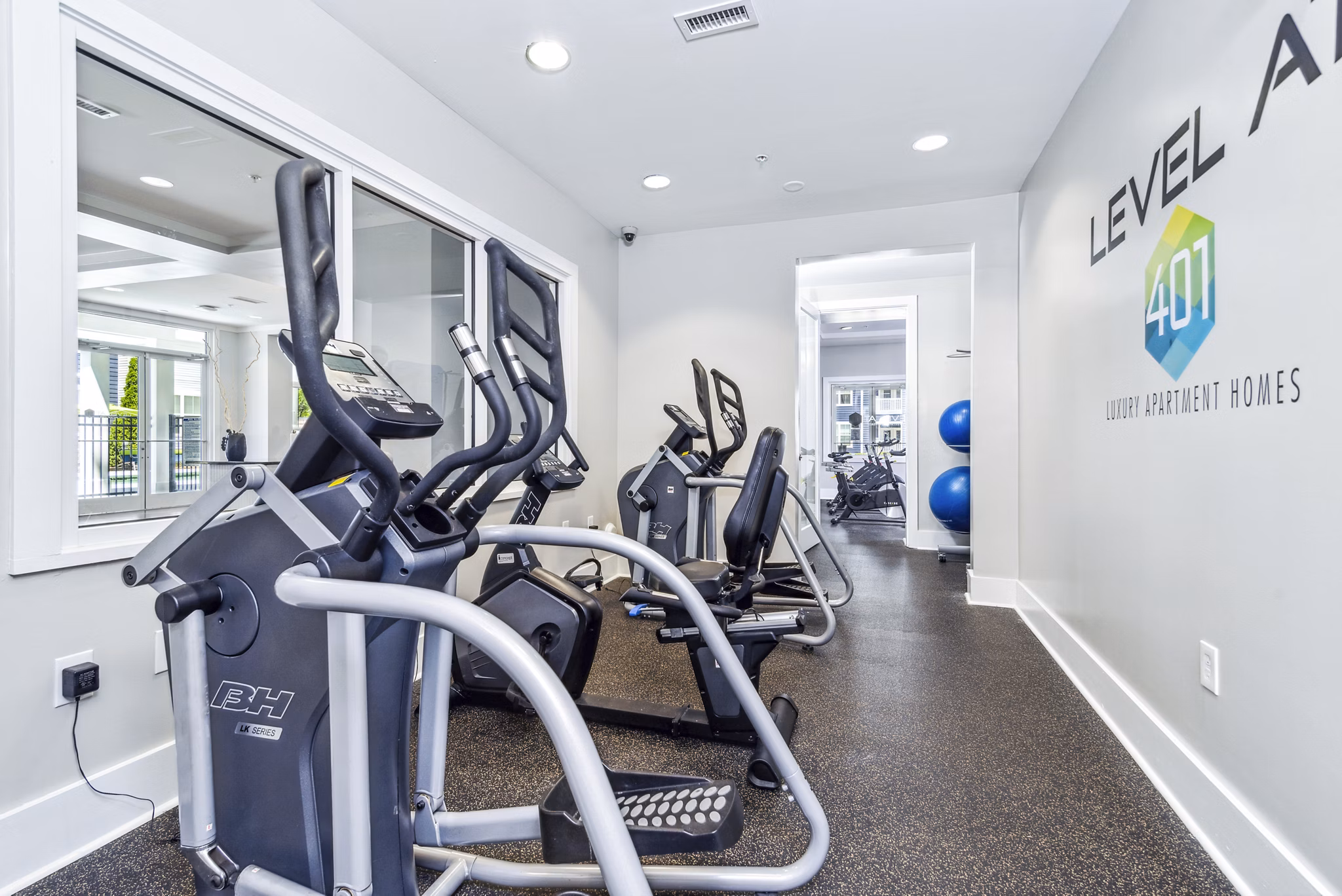 Modern fitness center with state-of-the-art equipment at Level at 401 Apartments, offering a premium workout experience