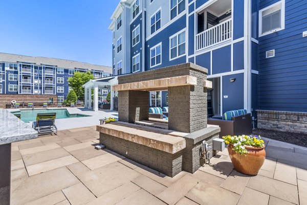 Fire pit on outdoor patio at Level at 401 Apartments, offering a cozy gathering space for residents to enjoy luxury living