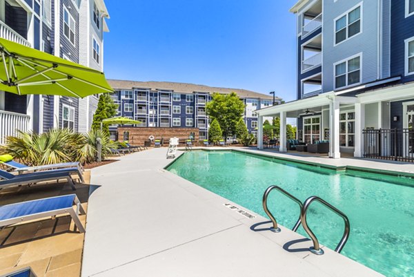 Sparkling rooftop pool with panoramic city views at Level at 401 Apartments