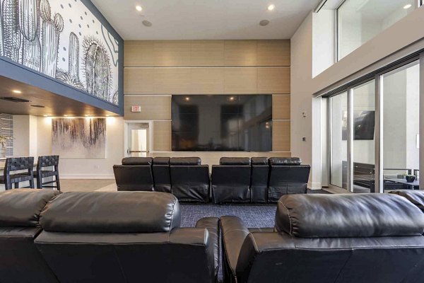 Cozy theater with plush seating at Slate Scottsdale Apartments, offering premium entertainment experiences in a luxury setting