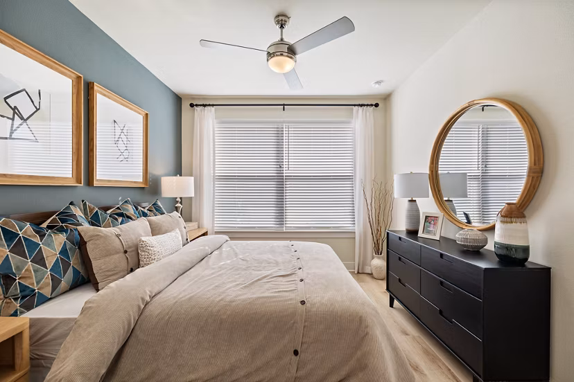 Cozy bedroom with modern decor at Birchway Perry Road Apartments