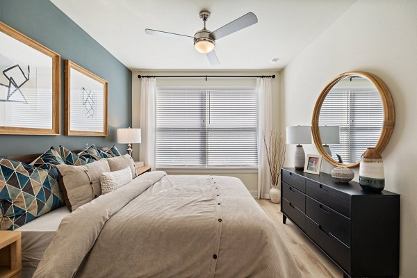 Cozy bedroom with modern decor at Birchway Perry Road Apartments