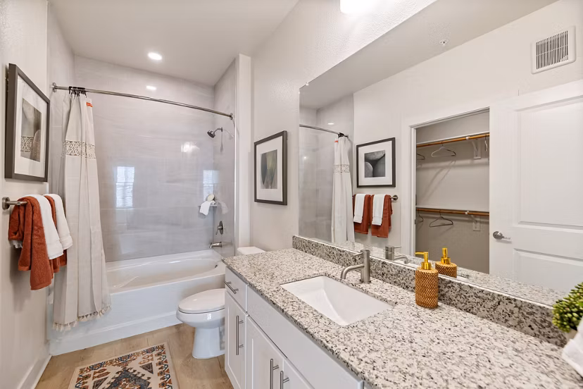 Modern bathroom with sleek fixtures in Birchway Perry Road Apartments