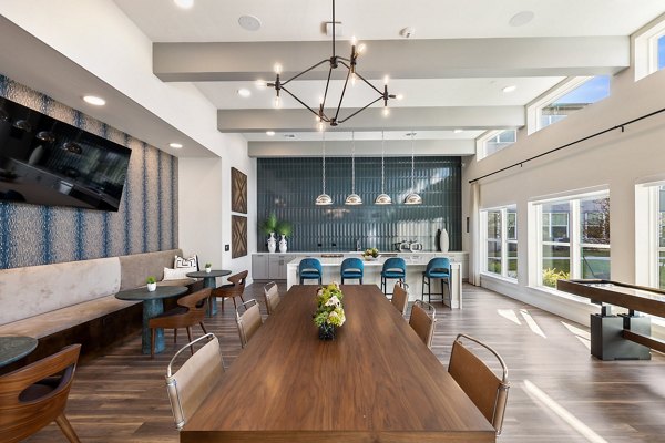 Clubhouse at Birchway Perry Road Apartments: Modern design with spacious seating and pool table for luxury social gatherings