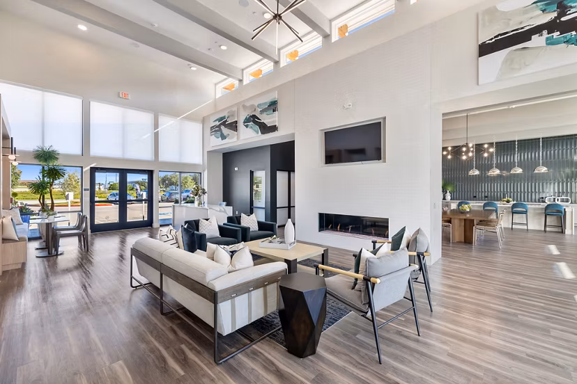Clubhouse with modern decor and seating areas at Birchway Perry Road Apartments