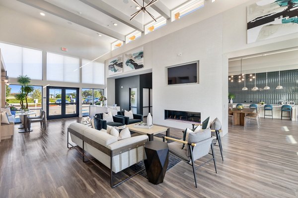 Clubhouse with modern decor and seating areas at Birchway Perry Road Apartments