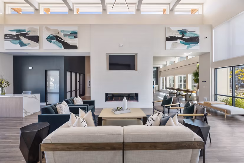 Modern clubhouse with cozy seating and billiards table at Birchway Perry Road Apartments