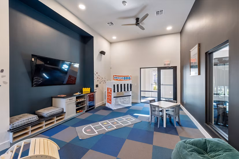 Colorful children's play area at Birchway Perry Road Apartments