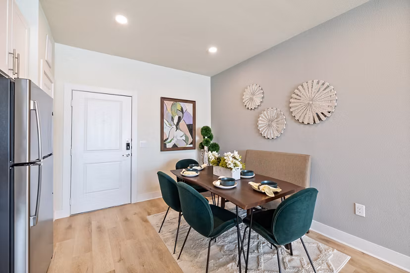Dining room with modern furnishings and elegant decor at Birchway Perry Road Apartments