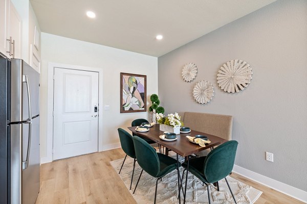 Dining room with modern furnishings and elegant decor at Birchway Perry Road Apartments