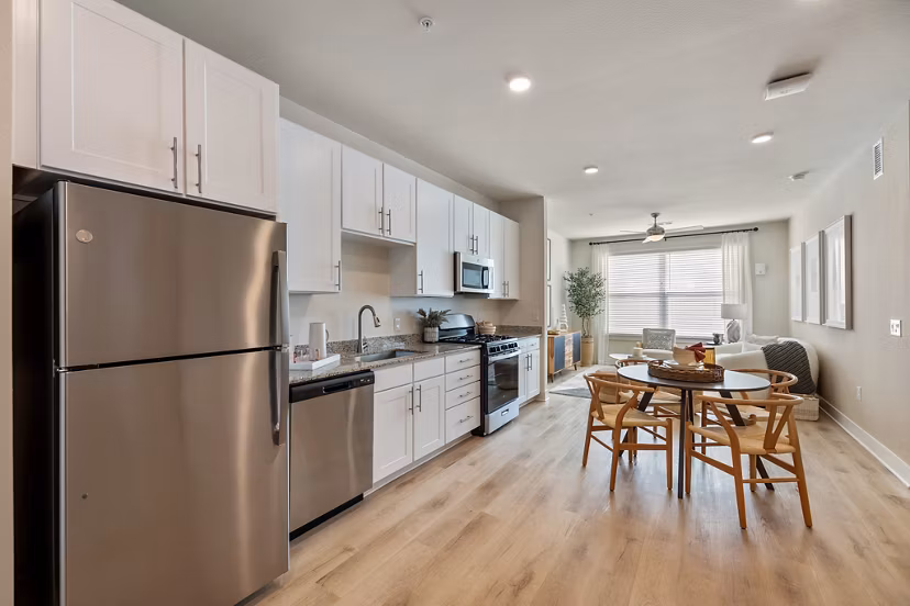 Modern kitchen with stainless steel appliances in Birchway Perry Road Apartments