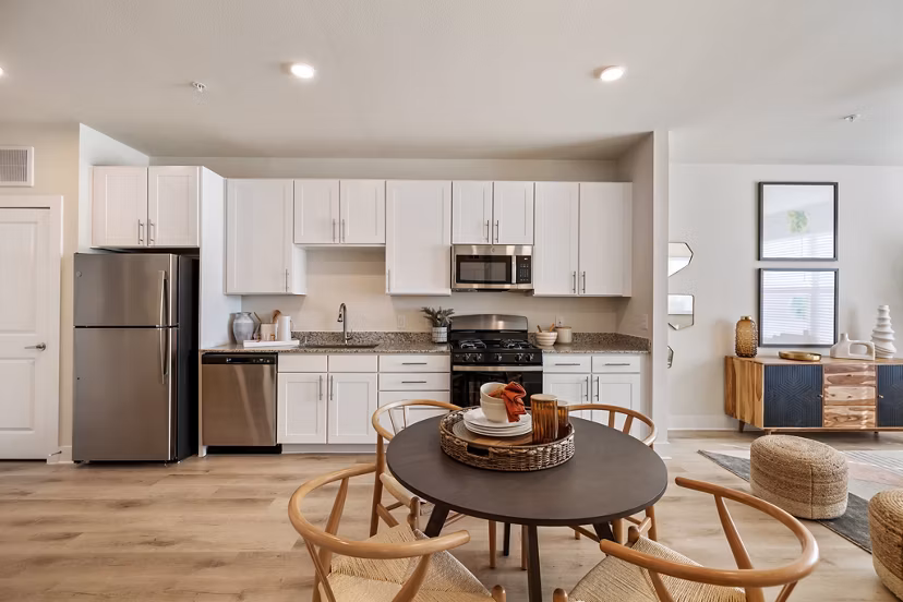 Modern kitchen with stainless steel appliances in Birchway Perry Road Apartments