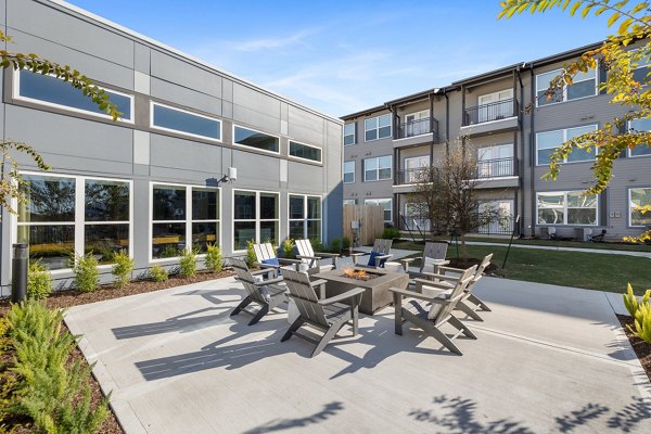 Cozy fire pit area perfect for gatherings at Birchway Perry Road Apartments