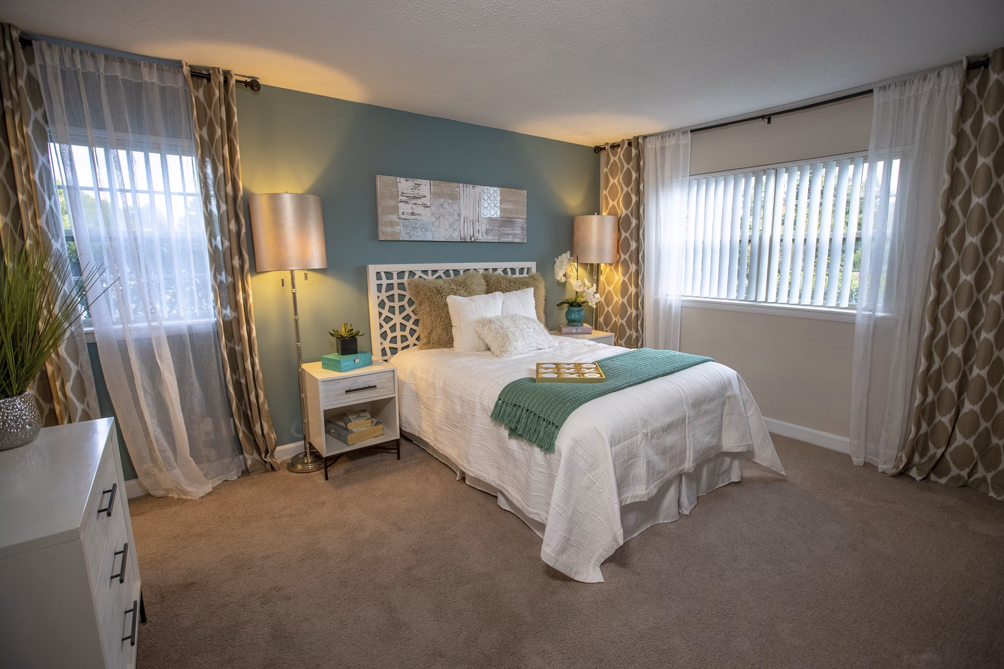 Spacious bedroom with modern furnishings at Collins Crossing Apartments