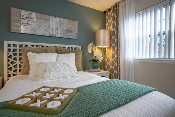 Modern bedroom with stylish decor at Collins Crossing Apartments, perfect for luxury living