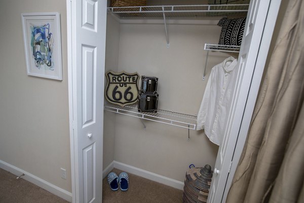Spacious bedroom with modern furnishings at Collins Crossing Apartments, offering luxury living in a prime location