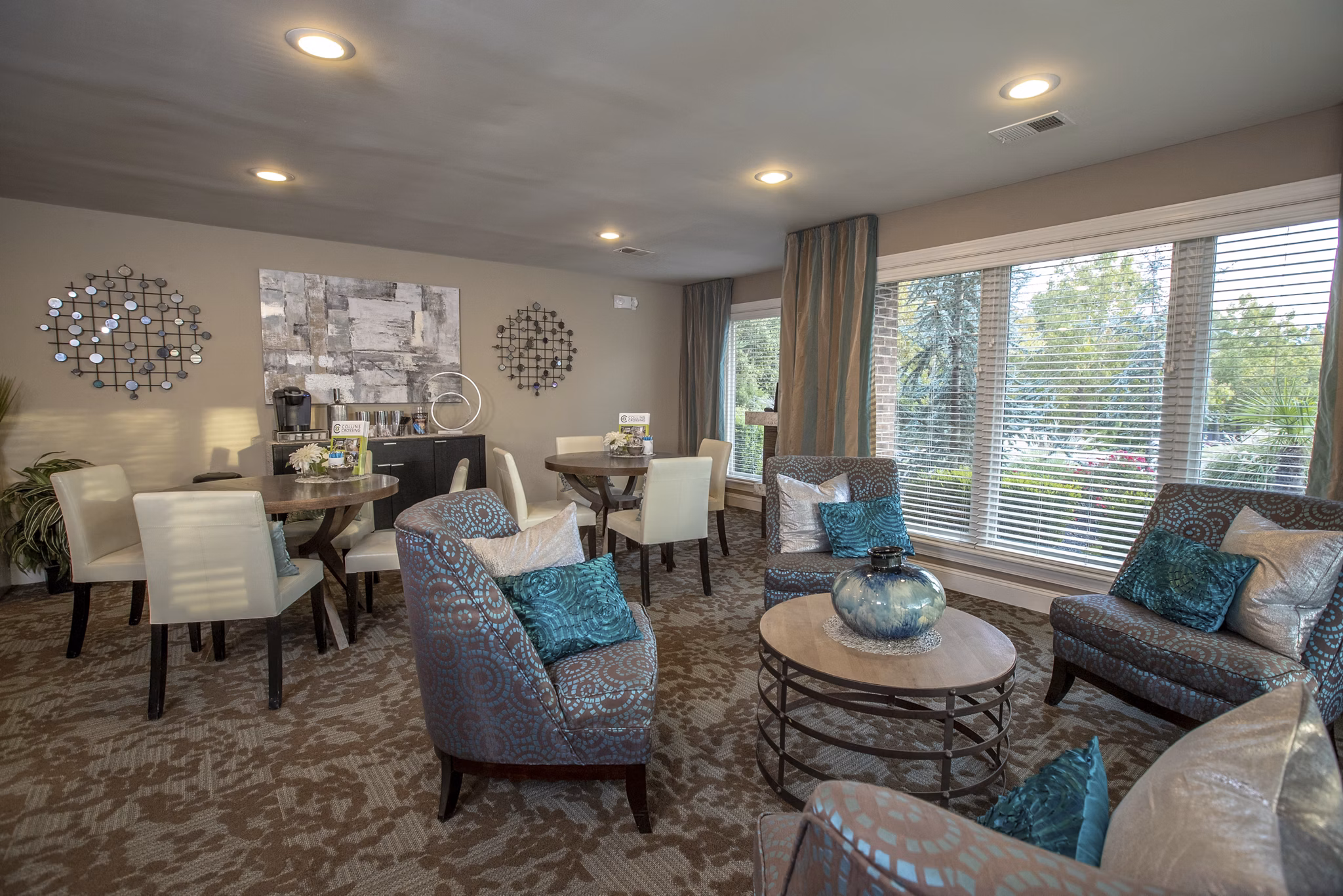 Clubhouse featuring modern decor and entertainment areas at Collins Crossing Apartments
