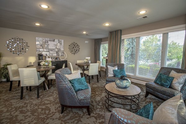 Clubhouse featuring modern decor and entertainment areas at Collins Crossing Apartments