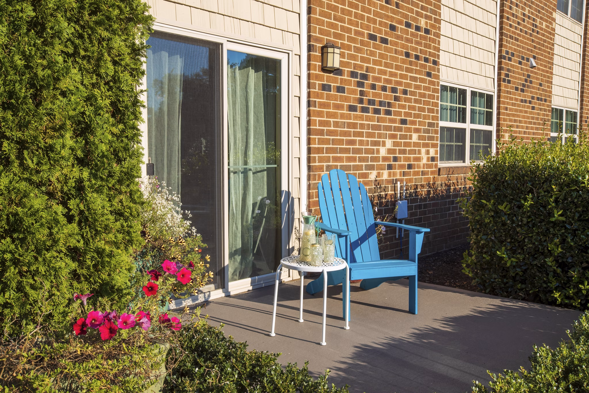 Spacious patio with modern furnishings at Collins Crossing Apartments, ideal for outdoor relaxation and gatherings