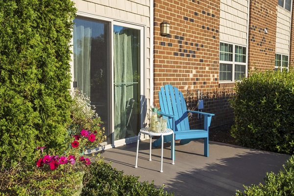 Spacious patio with modern furnishings at Collins Crossing Apartments, ideal for outdoor relaxation and gatherings