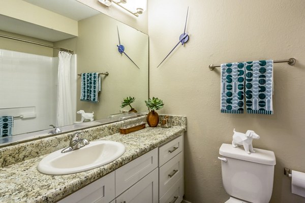 Bathroom featuring modern fixtures and spacious vanity at Fusion Apartments