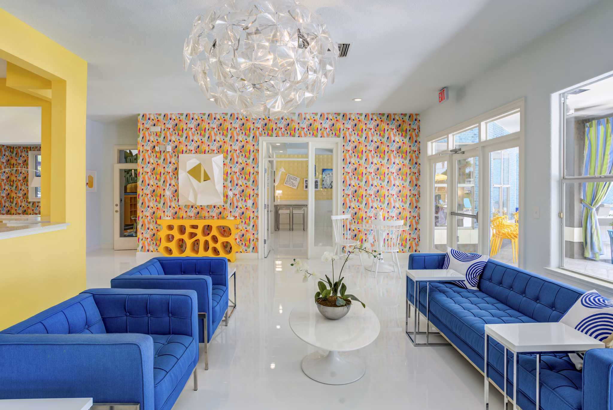 Modern clubhouse with stylish seating and entertainment options at Fusion Apartments