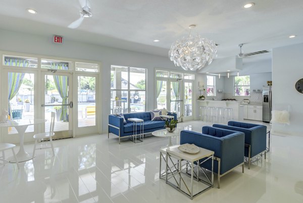 Clubhouse featuring modern design and communal seating at Fusion Apartments
